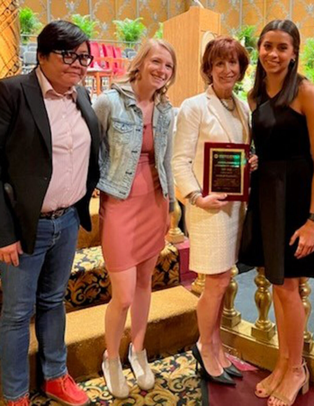 Accepting the award were SHIELD Illinois Operations Manager Shiow-Jiau Yung, Lab General Supervisor Jocelyn Carr, Assistant Dean for Operations Carol Schuster, and Collection Site Supervisor Bella Swan.