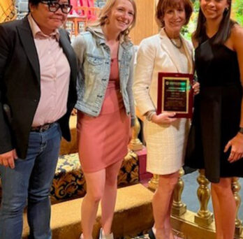 Accepting the award were SHIELD Illinois Operations Manager Shiow-Jiau Yung, Lab General Supervisor Jocelyn Carr, Assistant Dean for Operations Carol Schuster, and Collection Site Supervisor Bella Swan. 