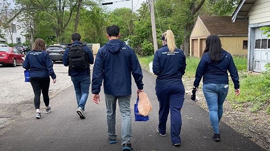 Residents, students and faculty participating in Mayor’s Neighborhood Improvement Initiative in May 2022.