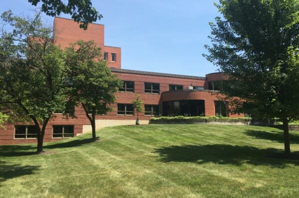 Exterior photo of a building and lawn.