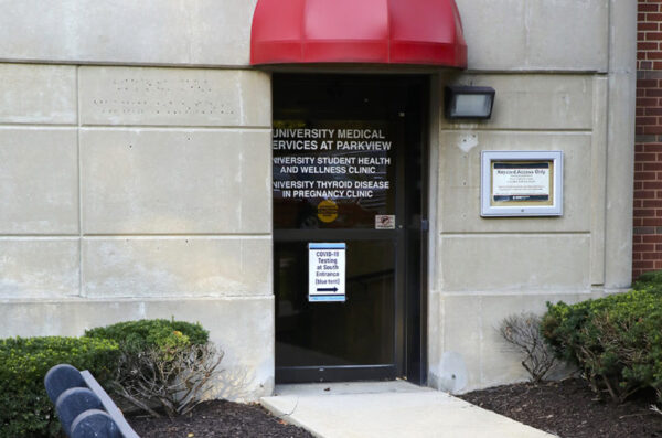 University Medical Services entry door with round red awning