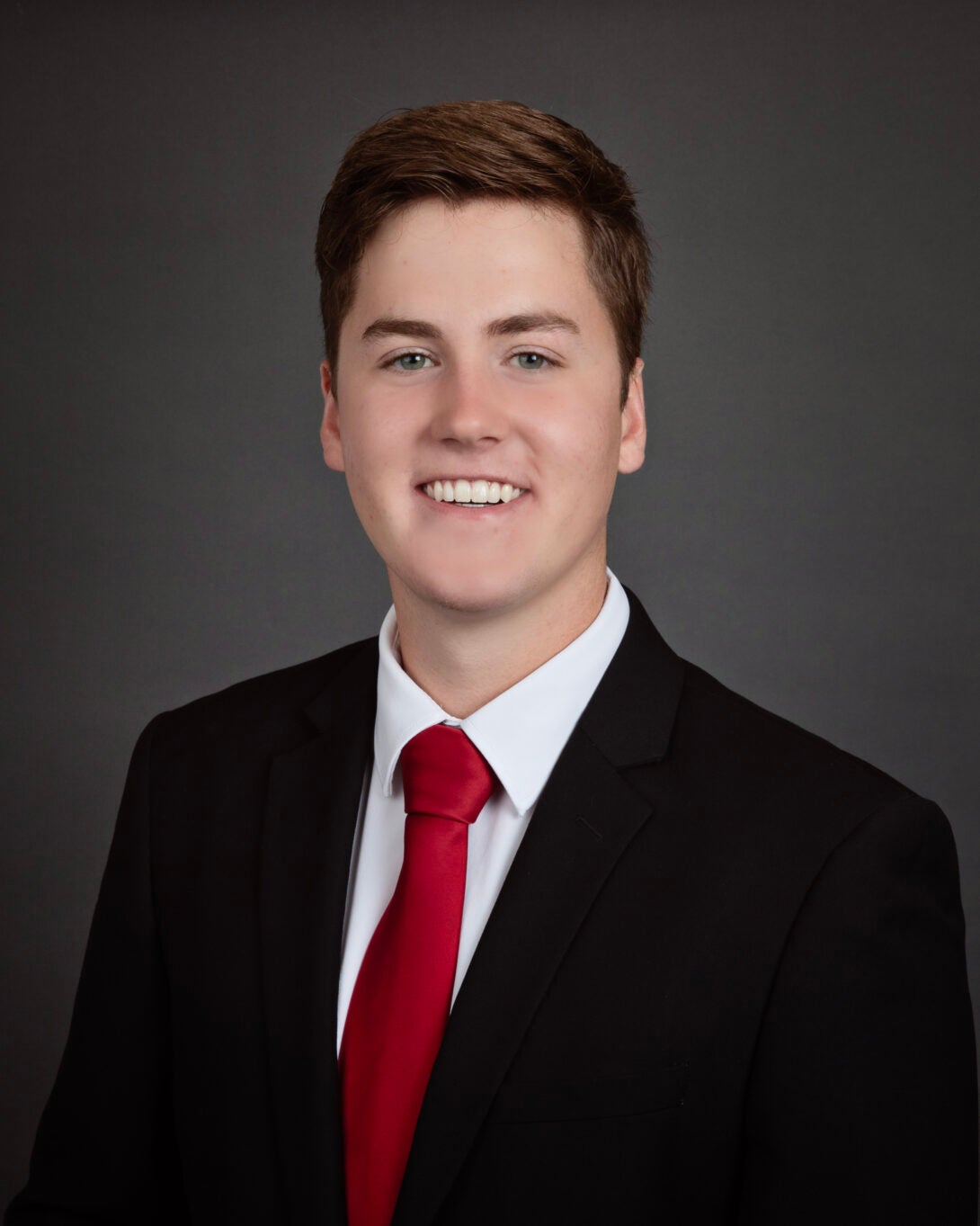 Hunter Eide, red tie, black coat