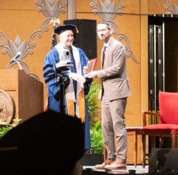 Mayor Tom McNamara received the Distinguished Community Award from Alex Stagnaro-Green, MD, MHPE, MHA, regional dean. 